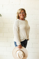 SHAE OATMEAL SWEATER WITH TWIST BOTTOM DETAIL AVAILABLE IN CURVY & REGULAR